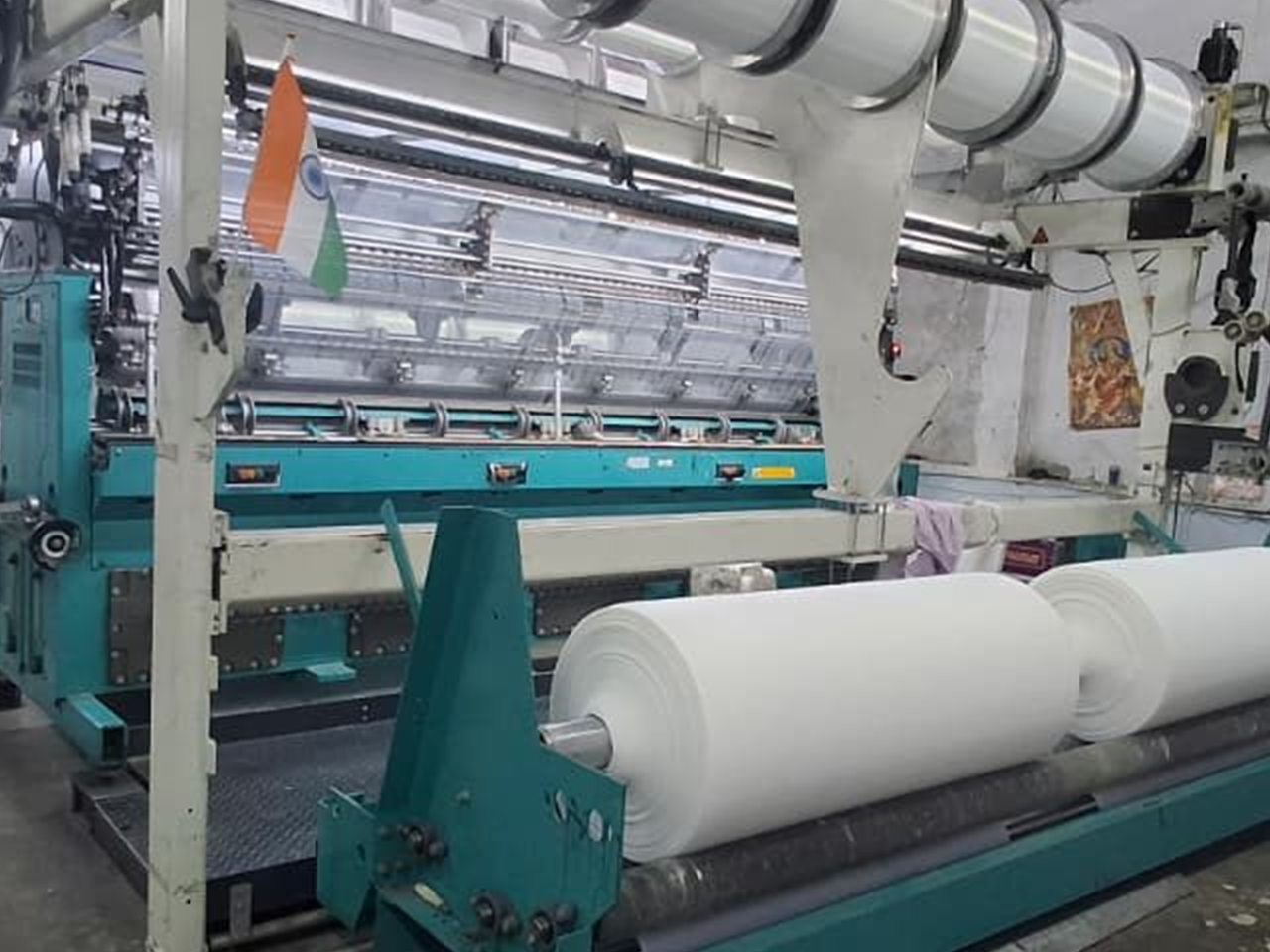 Warp knitting machines running fabric at Trustex