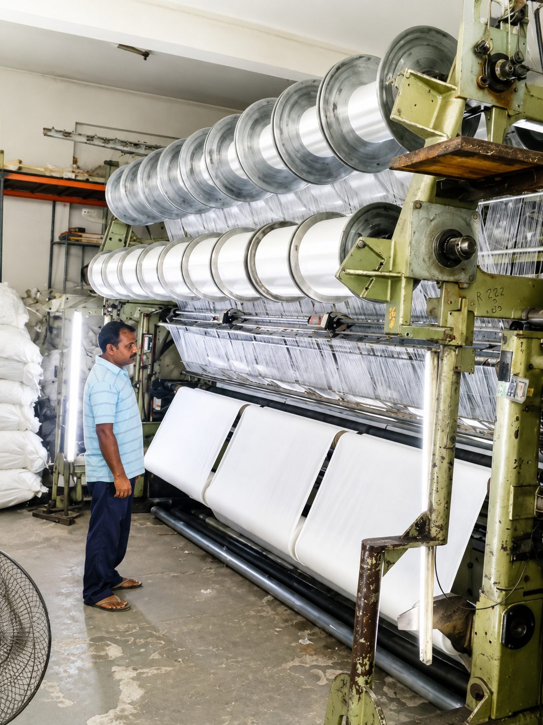 Row of warp-knitting machines at Trustex